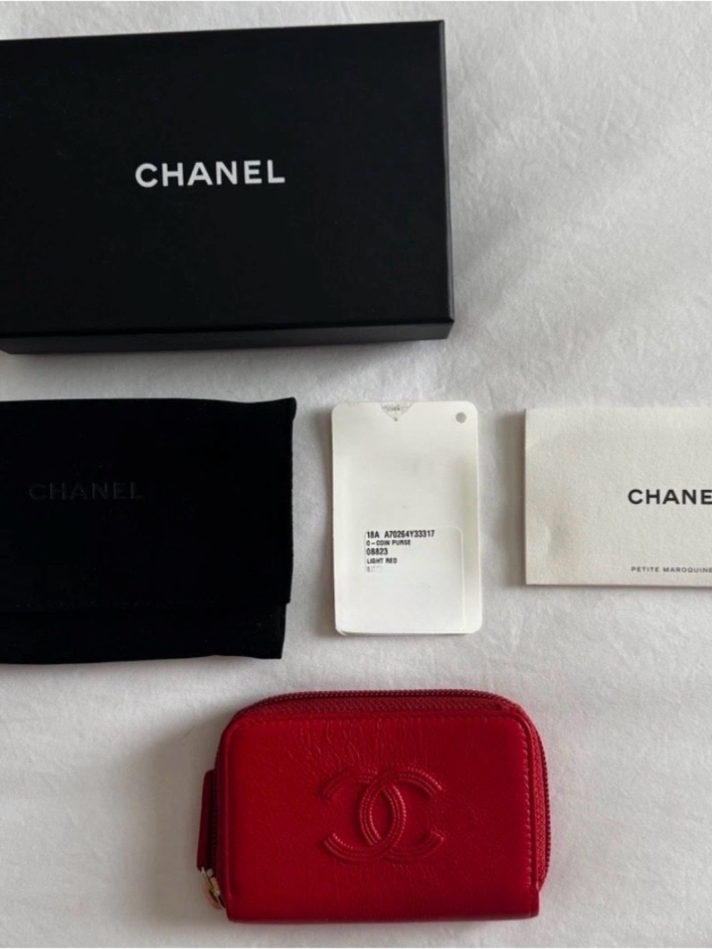 CHANEL Red Leather Zip Card Holder with Embossed CC